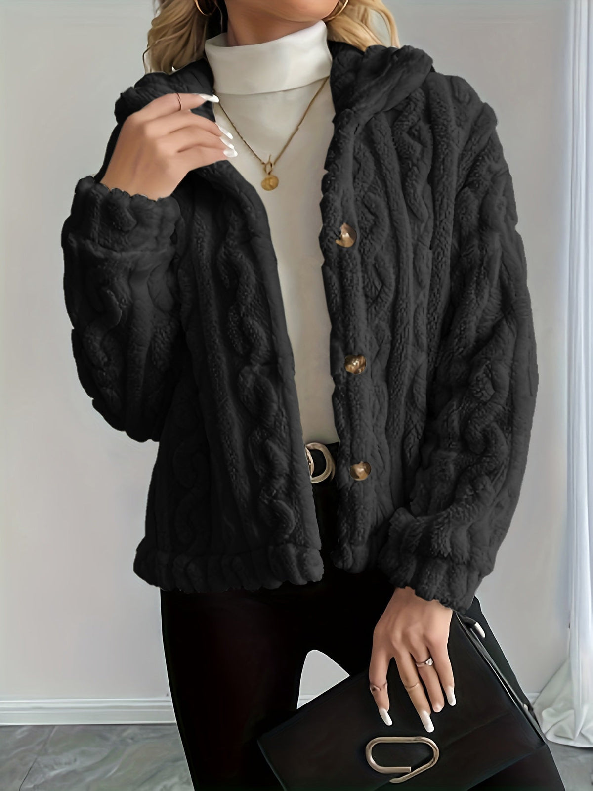 Gilet duveteux noir porté de face